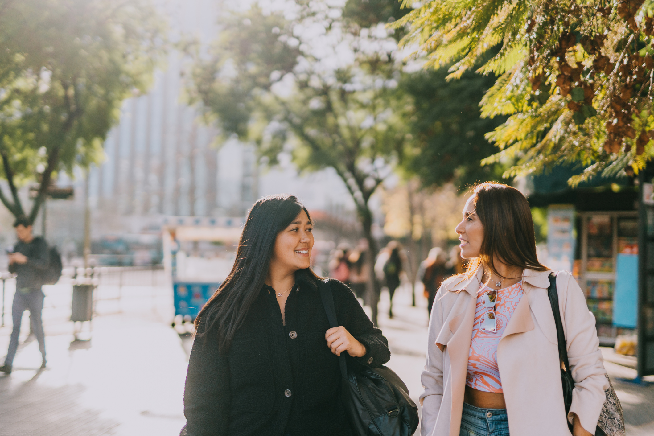 Women friends on their way to work in the city