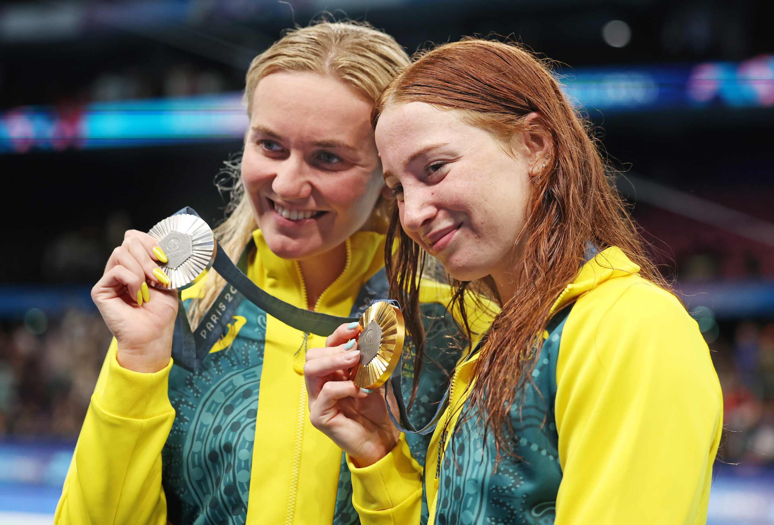 PARIS, FRANCE - JULY 29: Silver Medalist Ariarne Titmus and Gold Medalist Mollie O’Callaghan of Team Australia celebrates after the Medal Ceremony for the Women's 200m Freestyle Final on day three of the Olympic Games Paris 2024 at the Paris La Defense Arena on July 29, 2024 in Paris, France. (Photo by Ian MacNicol/Getty Images)