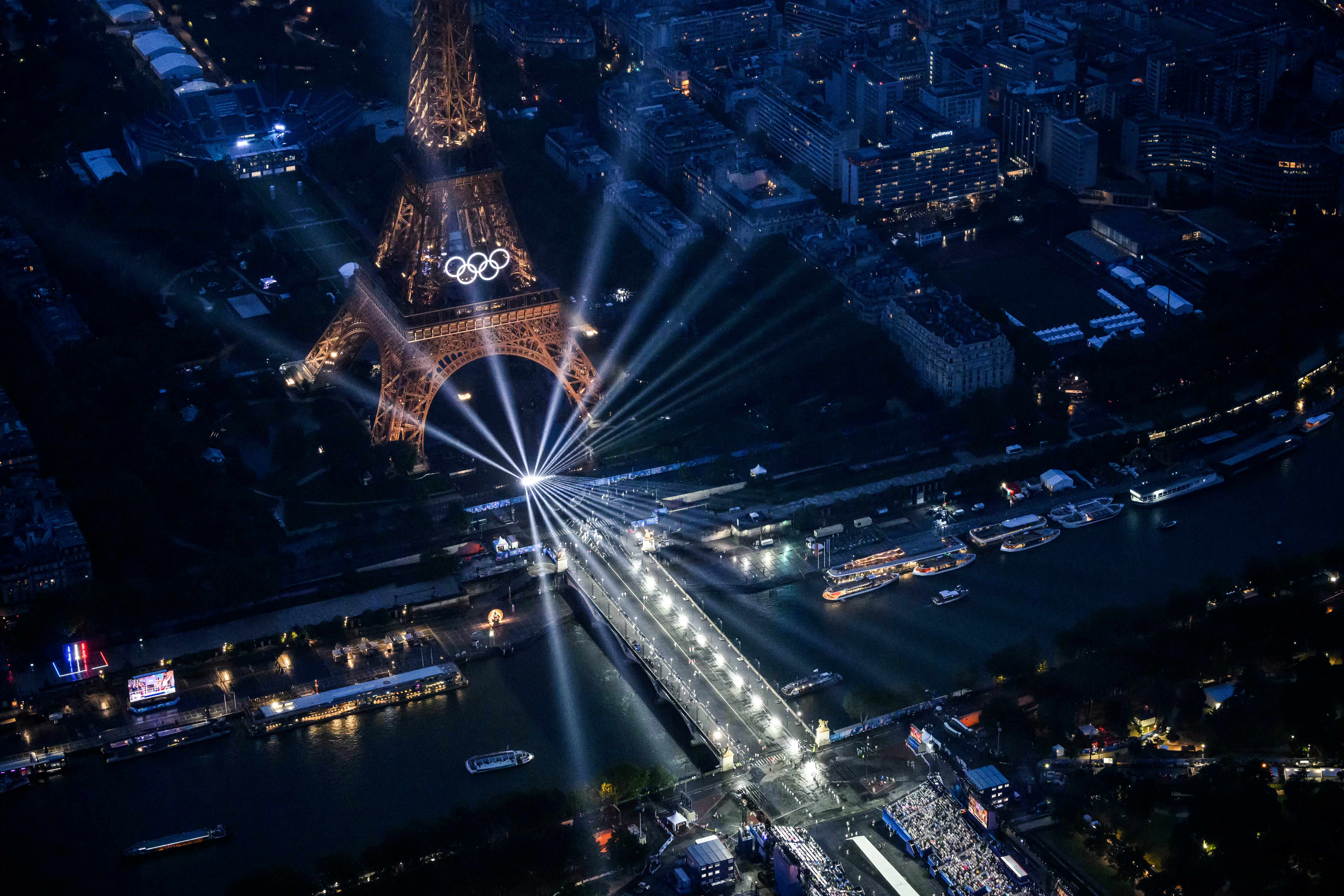 PARIS, FRANCE - JULY 26: An aerial view of the Olympic Rings on the Eiffel Tower taken from a helicopter during the opening ceremony of the Olympic Games Paris 2024 on July 26, 2024 in Paris, France.  (Photo by Lionel Bonaventure-Pool/Getty Images)