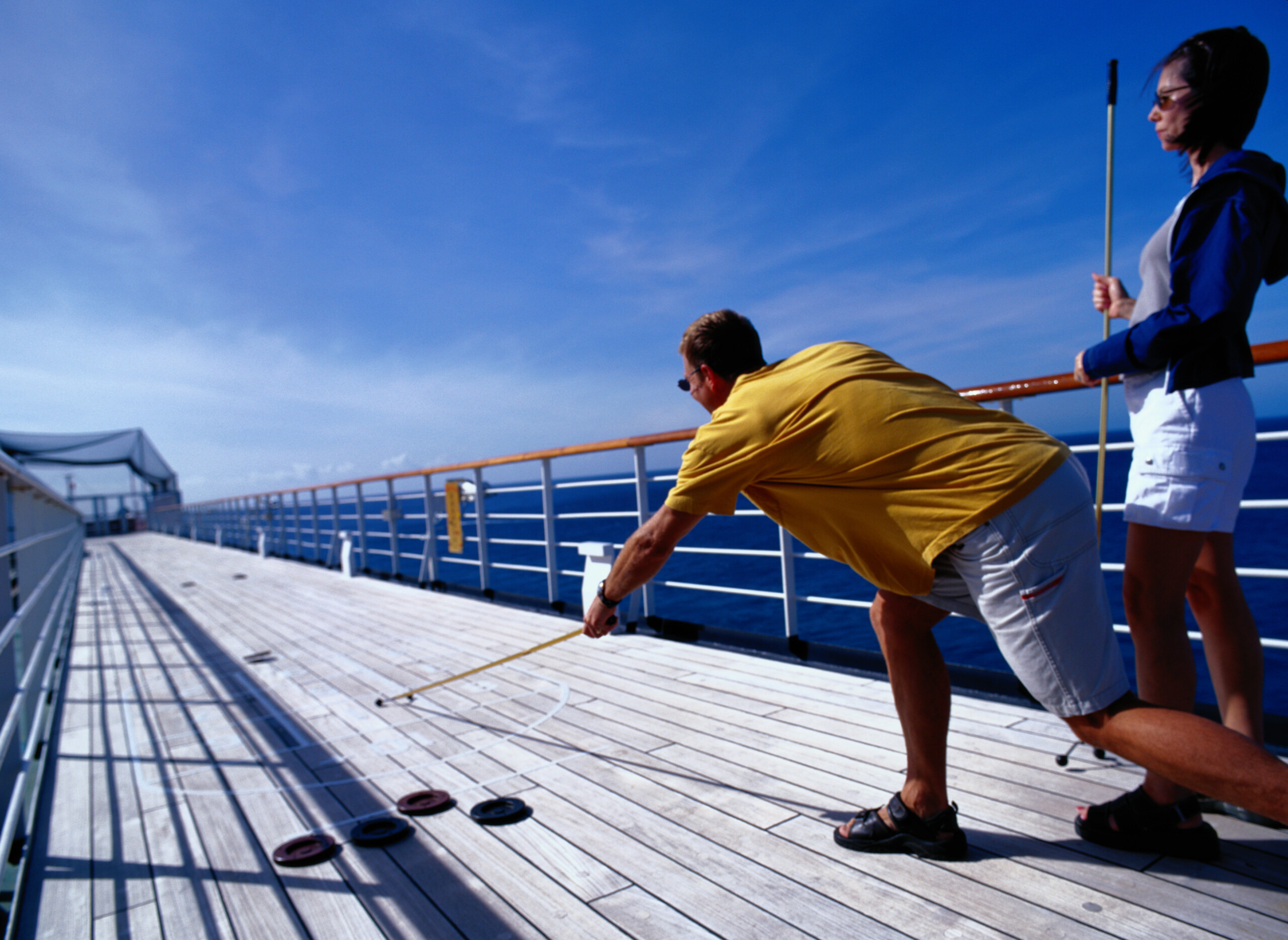 Couple Playing Shuffleboard on Cruise Ship